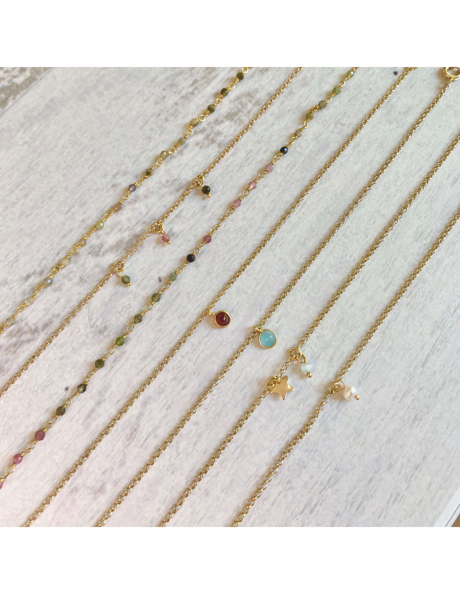 Tobillera Trio Mineral | cadena plata baño oro y tres mini minerales.